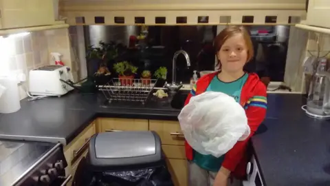 George Dowsett Jake Dowsett with bin and carrier bag