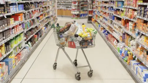 Getty Images Supermarket trolley and shelves