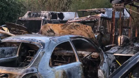 Vehicles gutted by fire