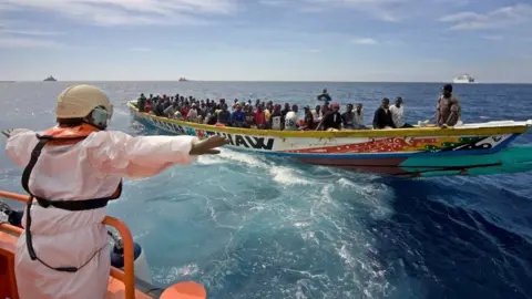 Getty Images A wooden boat of the kind Ousmane 'Doudou' Faye travelled in