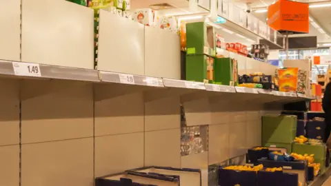 Getty Images Bare shelves in Iasi, Romania, 26 Feb 20