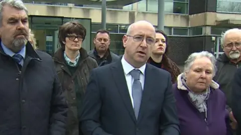 Det Ch Insp Brian Kearney, centre, with Marie Bailey next to him