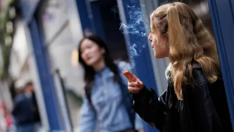 EPA-EFE/REX/Shutterstock A young person smoking