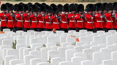 Reuters Members of the Irish Guard marching in the Tyne Cot cemetery