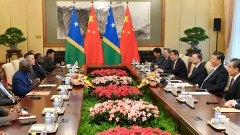Getty Images Solomon Islands' PM Sogavare (3rd left) in a meeting Chinese President Xi Jinping (1st right) in Beijing in 2019