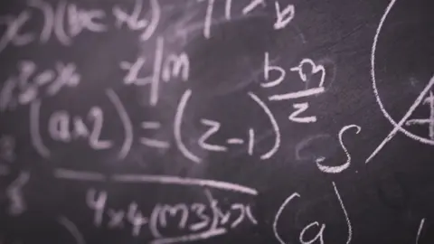 Getty Images Blackboard with chalk equations on