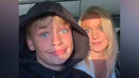 Family photo Mikey Roynon and mum smiling at the camera