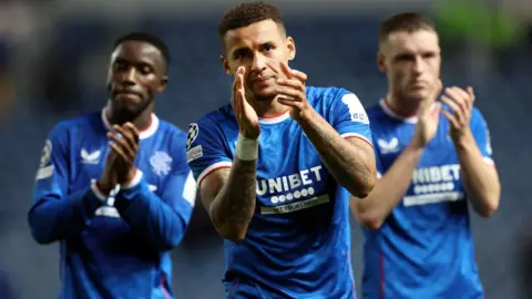 Rangers captain applauds the Ibrox crowd at full-time