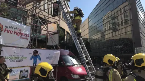 Huw Jakeway South Wales Fire and Rescue Service firefighters take part in the ladder climb