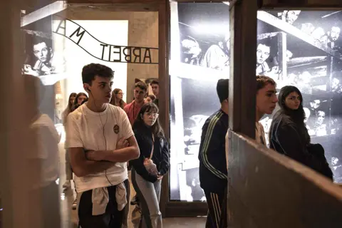 Menahem Kahana / AFP Young visitors were also seen at the Yad Vashem Holocaust Memorial museum in Jerusalem on 26 January 2023
