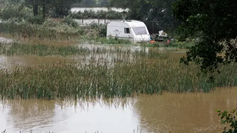 Athena Pictures A caravan underwater at Lakeside campsite