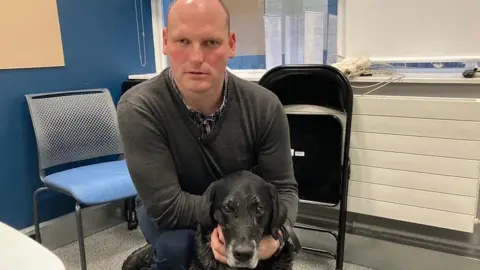 Sean Dilley and his guide dog