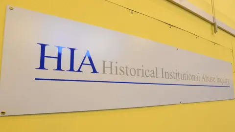 Pacemaker A sign that reads: Historical Institutional Abuse Inquiry