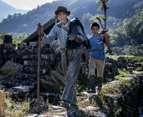 Sayan Hazra Men from the Khonoma tribe are seen walking in the village.