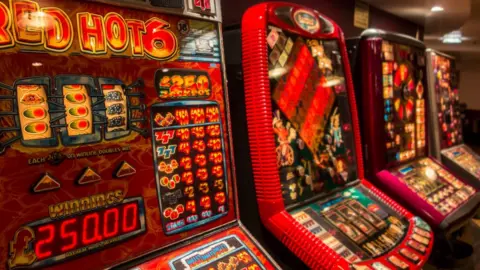 Getty Images Slot machines in a uk pub