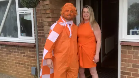 Micky Hyde Micky Hyde dressed in Luton orange with his fiancee