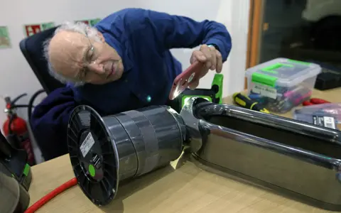 BBC Tony repairs a bladeless fan at the Fixing Factory in Camden, London