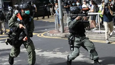 AFP Riot police fire pepper spray in Hong Kong