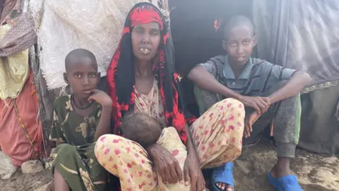 BBC/ Ed Habershon Dahir with his siblings and mother, Fatuma