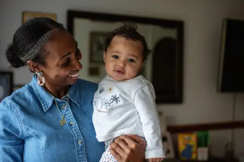 Nina Raingold A portrait of Naomi with her baby Akirou