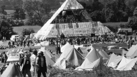 Getty Images June 1971: Hippies at the second Glastonbury Festival, which saw the first use of a pyramid stage.