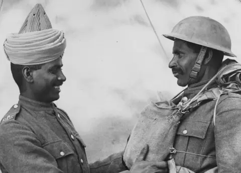 Fox Photos/Getty Images Two Two members of the BEF (British Expeditionary Forces) Indian Troops who have just arrived in England from Dunkirk. (Photo by Fox Photos/Getty Images