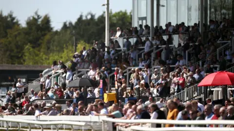 Getty Images Racegoers enjoy the sunny weather at Uttoxeter Racecourse on Sunday