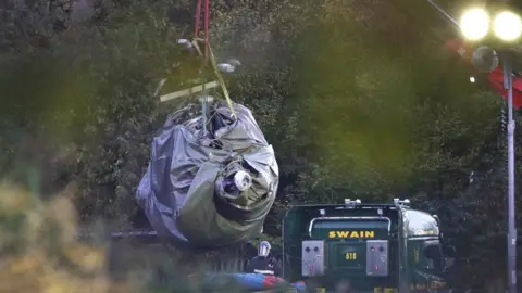 PA Helicopter removed from wreckage