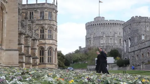 PA Media The Countess of Wessex, Lady Louise Windsor and the Earl of Wessex view flowers outside St George's Chapel, at Windsor Castle, on 16 April 2021