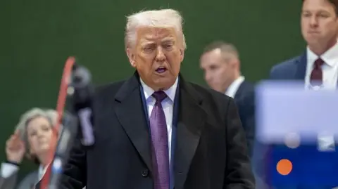 Trump speaks while answering journalists' questions in Davos