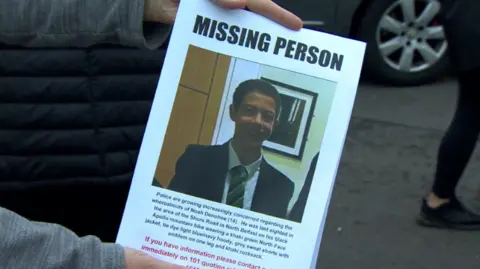 A missing person poster with Noah Donohoe's face on it 
