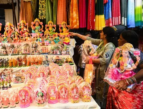 Getty Images People buy idols of Hindu goddess Lakshmi and other deities at a market in Hyderabad