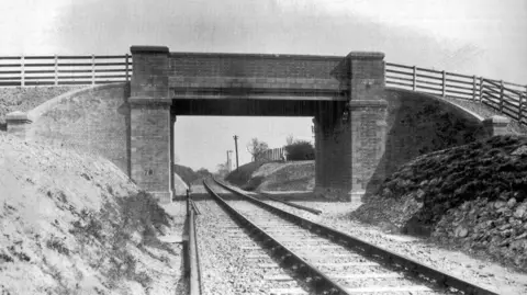 M&GN Trust Archive photo of Congham Bridge with a railway line passing through it