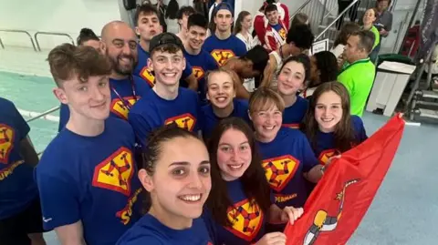 Laura Kinley Manx swimmers in 'supermanx' T-shirts