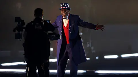 Reuters The half-time show opens with Samuel L Jackson dressed as Uncle Sam