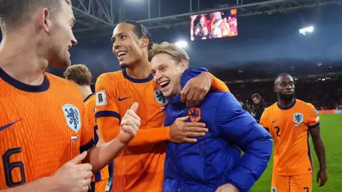 Matthijs de Ligt of Holland, Virgil van Dijk of Holland, Frenkie de Jong of Holland celebrate qualifying for the 2026 FIFA World Cup