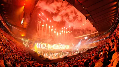 Getty Images Red fireworks illuminate the night sky over Celtic park during the 2014 Commonwealth Games opening ceremony.