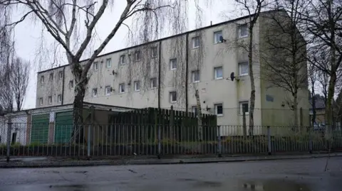 Photo of Tom's block of flats in Luton on a grey, wet day