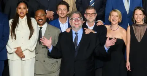 AMPAS Zinzi and Ryan Coogler, Timothée Chalamet, Guillermo del Toro, Paul Thomas Anderson and Jessie Buckley in the Oscars class photo
