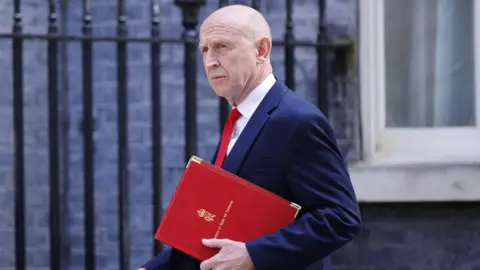 EPA Britain's Secretary of State for Defence John Healey arrives at 10 Downing Street for a cabinet meeting, 