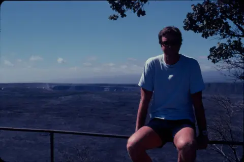 Sherri Crichton Michael Crichton pictured by a volcanic rim