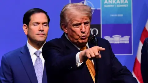 Donald Trump holds a press conference at Nato.