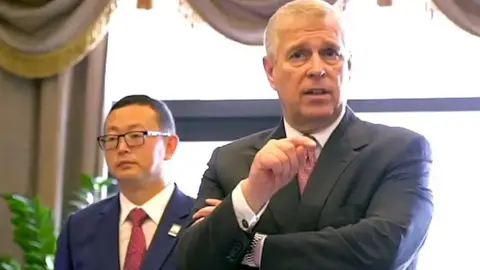 Supplied Mr Yang is seen here with Prince Andrew