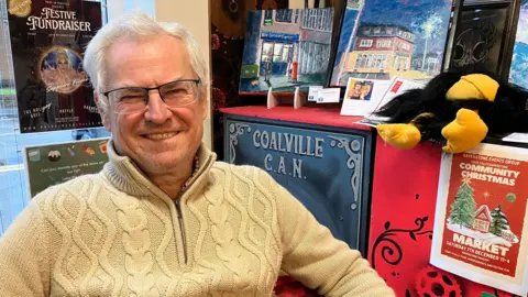 Ian Wilson, chief executive of Coalville CAN sits in a comfy chair in the 'Makers' shop in CAN's headquarters