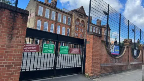 Exterior shot of Earlsfield Primary School with gates shut 