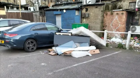 A large pile of household waste was dumped outside Buzz Bingo Hall 