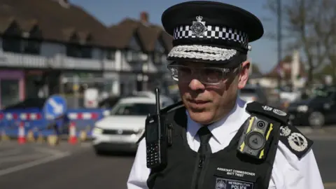 Metropolitan Police Assistant Commissioner Matt Twist speaks to the BBC on an Orpington street