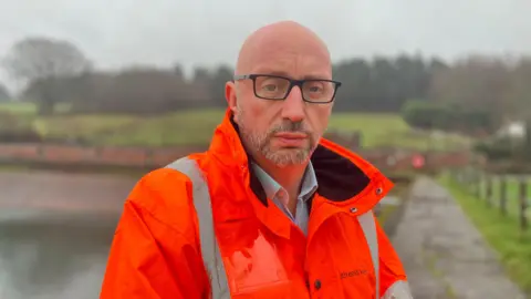 A man in a hi vis jacket