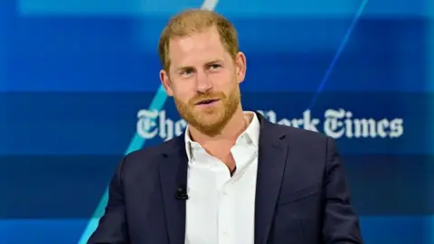 Eugene Gologursky / Stringer/Getty Images Prince Harry speaking on stage