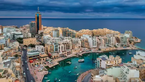 Buildings and boats at Spinola bay in Malta